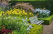 ROCKINGHAM CASTLE, NORTHAMPTONSHIRE: BORDER, SEAT, BENCH, SCABIOSA PERFECTION BLUE, GLADIOLUS EVERGREEN, HEMEROCALLIS GOLDEN CHIMES, RUDBECKIA AUTUMN FOREST, WEIGELIA