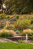 FRANT GARDEN, CHRIS BROWN: WATER GARDEN, FORMAL, COUNTRY, GARDEN, FOUNTAIN, BORDERS, STEPS, SLOPE, SLOPING, PERENNIALS, GRASSES