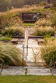 FRANT GARDEN, CHRIS BROWN: WATER GARDEN, FORMAL, COUNTRY, GARDEN, FOUNTAIN, BORDERS, STONE SEAT, BENCH, PERENNIALS, GRASSES