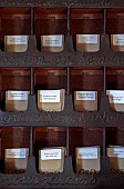 GREEN & GORGEOUS FLOWERS, OXFORDSHIRE: SEPTEMBER: SEEDS IN PACKETS IN OLD METAL RACK READY FOR SALE TO THE PUBLIC