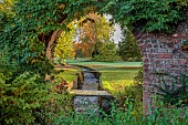 LLANOVER GARDEN, MONMOUTHSHIRE: AUTUMN COLOUR, FALL, OCTOBER, RILL, WATER, ARCH IN THE WALLED GARDEN, ROUND GARDEN, VISTA, VIEW