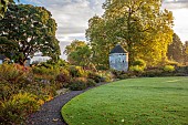 LLANOVER GARDEN, MONMOUTHSHIRE: WALLED, ROUND GARDEN, OCTOBER, BORDER, LAWN, PATH, DOVECOTE, GRASSES, PERENNIALS, SALVIAS, DAHLIA DAVID HOWARD, ASTER LITTLE CARLOW, ACER GRISEUM