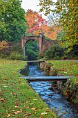 LLANOVER GARDEN, MONMOUTHSHIRE: OCTOBER, FALL, STREAM, TREES, LAWN, PARKLAND, WALLED GARDEN, BRIDGES