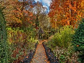 YORK GATE GARDEN, YORKSHIRE: AUTUMN, FALL, LEAVES, TREES, CARPET PATH, OPHIOPOGON, GAZEBO, FORMAL, SMALL, GARDEN, DECORATIVE PATHS