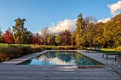 NATURAL SWIMMING POND GARDEN, ITALY BY GPT STUDIO, FALL, AUTUMN, OCTOBER, DECKING, SWIMMING POOL, WATER, BORROWED LANDSCAPE