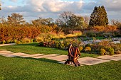 NATURAL SWIMMING POND GARDEN, ITALY BY GPT STUDIO, FALL, AUTUMN, OCTOBER, PATH, LAWN, SCULPTURE BY LEON BRONSTEIN