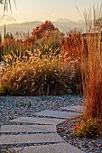 NATURAL SWIMMING POND GARDEN, ITALY BY GPT STUDIO, AUTUMN, OCTOBER, PENNISETUM HAMELN, GRAVEL, STEPPING STONES, PATHS