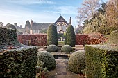 WOLLERTON OLD HALL, SHROPSHIRE: NOVEMBER, FROST, WINTER, VIEW OF HOUSE FROM THE LIME ALLEE, CLIPPED TOPIARY, YEW, BEECH HEDGES, HEDGING, POOL, POND, FORMAL, COUNTRY, GARDEN