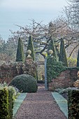 WOLLERTON OLD HALL, SHROPSHIRE: NOVEMBER, FROST, WINTER, VIEW ALONG PATH TO WELL GARDEN, WALLS, GATE, CLIPPED TOPIARY YEW, FORMAL, COUNTRY, GARDEN