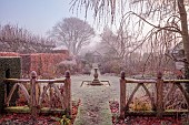 WOLLERTON OLD HALL, SHROPSHIRE: NOVEMBER, FROST, WINTER, DECORATIVE WOODEN FENCE, FENCING, STONE SUNDIAL, SUNDIAL GARDEN, FORMAL, COUNTRY