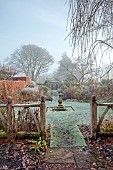 WOLLERTON OLD HALL, SHROPSHIRE: NOVEMBER, FROST, WINTER, DECORATIVE WOODEN FENCE, FENCING, STONE SUNDIAL, SUNDIAL GARDEN, FORMAL, COUNTRY