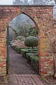 WOLLERTON OLD HALL, SHROPSHIRE: NOVEMBER, FROST, WINTER, THE LONG WALK, BRICK ARCHWAY, CLIPPED TOPIARY