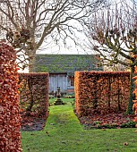 WOLLERTON OLD HALL, SHROPSHIRE: VIEW PAST BEECH HEDGES, HEDGING TO SUNDIAL GARDEN, GARDEN ROOM