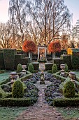THE LASKETT GARDEN, HEREFORDSHIRE: WINTER, FROST, JANUARY, SILVER JUBILEE GARDEN, BOX PARTERRE, SUNDIAL, BERGENIA, PIERPONT MORGAN ROSE GARDEN, CLIPPED BEECH TREES