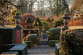THE LASKETT GARDEN, HEREFORDSHIRE: WINTER, FROST, JANUARY, CLIPPED TOPIARY YEW, HEDGES, HEDGING, STATUE OF BRITANNIA, TOPIARY YEW