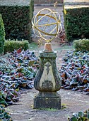 THE LASKETT GARDEN, HEREFORDSHIRE: WINTER, FROST, JANUARY, SILVER JUBILEE GARDEN, BOX PARTERRE, SUNDIAL, BERGENIA, PATH