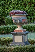 THE LASKETT GARDEN, HEREFORDSHIRE: WINTER, FROST, JANUARY, SILVER JUBILEE GARDEN, URN, CONTAINER WITH SEMPERVIVIUMS