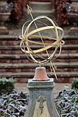 THE LASKETT GARDEN, HEREFORDSHIRE: WINTER, FROST, JANUARY, SUNDIAL IN THE SILVER JUBILEE GARDEN