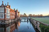 HELMINGHAM HALL GARDENS, SUFFOLK: WINTER, FROST, JANUARY, THE HALL AND MOAT