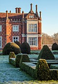 HELMINGHAM HALL GARDENS, SUFFOLK: WINTER, FROST, JANUARY, BOX PARTERRE, CLIPPED TOPIARY YEW