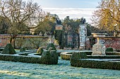 HELMINGHAM HALL GARDENS, SUFFOLK: WINTER, FROST, JANUARY, BOX PARTERRE, CLIPPED TOPIARY, HEGDES, HEDGING, STONE URN