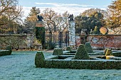 HELMINGHAM HALL GARDENS, SUFFOLK: WINTER, FROST, JANUARY, BOX PARTERRE, CLIPPED TOPIARY, HEGDES, HEDGING, STONE URN