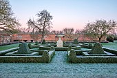 HELMINGHAM HALL GARDENS, SUFFOLK: WINTER, FROST, JANUARY, BOX PARTERRE, CLIPPED TOPIARY, HEGDES, HEDGING, STONE URN