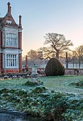 HELMINGHAM HALL GARDENS, SUFFOLK: WINTER, FROST, JANUARY, SUNDIAL, CLIPPED YEW TOPIARY