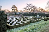 HELMINGHAM HALL GARDENS, SUFFOLK: WINTER, FROST, JANUARY, THE KNOT GARDEN, BOX HEDGES, HEDGING, YEW HEDGES