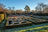 HELMINGHAM HALL GARDENS, SUFFOLK: WINTER, FROST, JANUARY, THE KNOT GARDEN, BOX HEDGES, HEDGING, YEW HEDGES