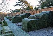 HELMINGHAM HALL GARDENS, SUFFOLK: WINTER, FROST, JANUARY, THE WALLED GARDEN, CLIPPED TOPIARY YEWS, PATH, WALLS