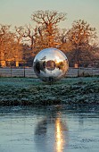 HELMINGHAM HALL GARDENS, SUFFOLK: WINTER, FROST, JANUARY, MOAT, DAVID HARBER SUNDIAL, REFLECTED, REFLECTIONS