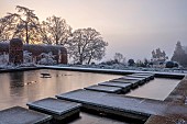 BROUGHTON GRANGE GARDENS, OXFORDSHIRE: WINTER, FROST, JANUARY, RECTANGULAR POND, POOL, STEPPING STONES