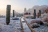 BROUGHTON GRANGE GARDENS, OXFORDSHIRE: WINTER, FROST, JANUARY, RILL, WATER, CLIPPED, TOPIARY, CUPRESSUS SEMPERVIRENS, ITALIAN CYPRESS
