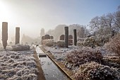 BROUGHTON GRANGE GARDENS, OXFORDSHIRE: WINTER, FROST, JANUARY, RILL, WATER, CUPRESSUS SEMPERVIRENS, ITALIAN CYPRESS