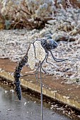 BROUGHTON GRANGE GARDENS, OXFORDSHIRE: WINTER, FROST, JANUARY, FROSTED DRAGONFLY SCULPTURE IN RILL