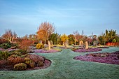 HOLME FOR GARDENS, DORSET, FEBRUARY, HENGE GARDEN, HOLME HENGE, STONE CIRCLE OF PURBECK STONE MONOLITHS, HEATHERS, PINES, WINTER GARDEN