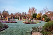 HOLME FOR GARDENS, DORSET, FEBRUARY, HENGE GARDEN, HOLME HENGE, STONE CIRCLE OF PURBECK STONE MONOLITHS, HEATHERS, PINES, WINTER GARDEN