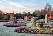 HOLME FOR GARDENS, DORSET, FEBRUARY, HENGE GARDEN, HOLME HENGE, STONE CIRCLE OF PURBECK STONE MONOLITHS, HEATHERS, PINES, WINTER GARDEN