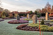HOLME FOR GARDENS, DORSET, FEBRUARY, HENGE GARDEN, HOLME HENGE, STONE CIRCLE OF PURBECK STONE MONOLITHS, HEATHERS, PINES, WINTER GARDEN