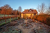 HILL FARM , SURREY, DESIGNER HELEN THOMAS: WINTER, FEBRUARY, THE KITCHEN GARDEN, POTAGER, DAWN, SUNRISE, GARDEN BUILDING