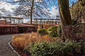 LITTLETHORPE MANOR, YORKSHIRE, FEBRUARY, WINTER GARDEN: FRONT GRAVEL DRIVE, HEDGES, HEDGING, BEECH, YEW, PLEACHED HORNBEAM