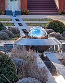 LITTLETHORPE MANOR, YORKSHIRE, FEBRUARY, WINTER GARDEN: STAINLESS STEEL RILL, WATER FEATURE