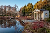 LITTLETHORPE MANOR, YORKSHIRE, FEBRUARY, WINTER GARDEN: LAKE, PAVILION, CORNUS ALBA SIBIRICA, TREES, WOODEN PONTOON, DECKING