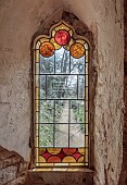 PAINSWICK ROCOCO GARDEN, GLOUCESTERSHIRE: MARCH, SPRING, STAINED GLASS WINDOW IN THE RED HOUSE, FOLLY, FOLLIES