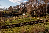 PAINSWICK ROCOCO GARDEN, GLOUCESTERSHIRE: MARCH, VIEW TO EXEDRA, DAFFODILS, NARCISSUS