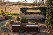 OLD PARK BARN, BUCKINGHAMSHIRE: SPRING, MARCH, WATER FEATURE, PEBBLES, WALL, IVY