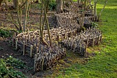OLD PARK BARN, BUCKINGHAMSHIRE: SPRING, MARCH, LAND ART SCULPTURE, RIVER OF STICKS