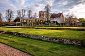 ASHBY MANOR HOUSE, NORTHAMPTONSHIRE, APRIL, LAWN, CHURCH, SUNSET, EVENING LIGHT