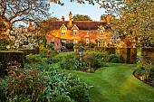 DESIGNER ANGEL COLLINS, SPRING, APRIL: LAWN, HOUSE, BORDERS, PATHS, SUNDIAL